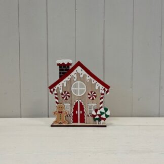 Red Wooden Gingerbread House with Candy Cane and Sprinkles
