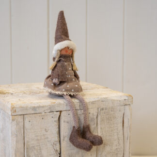 Fabric Sitting Girl in Brown Outfit