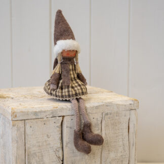 Fabric Sitting Girl in Brown Outfit