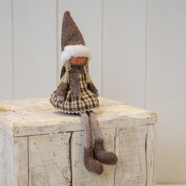 Fabric Sitting Girl in Brown Outfit