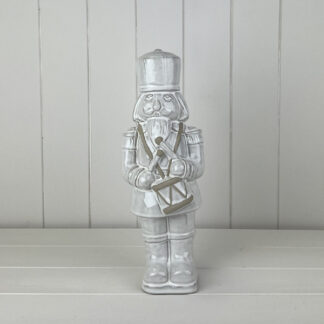Glazed Ceramic Nutcracker Ornament With Textured Detail