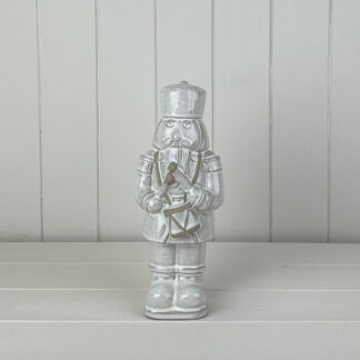 Glazed Ceramic Nutcracker Ornament With Textured Detail