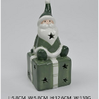 Nordic Green Santa sitting on LED Present
