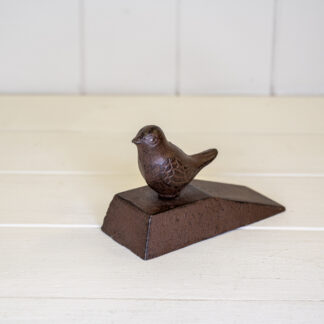Cast iron door wedge with bird deco