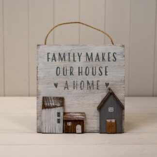 White Wooden Home Sign 'Family Makes Our House A Home' With Grey White and Brown Stand Out Houses